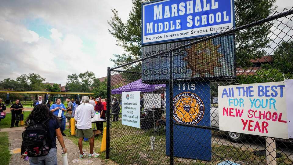Students arrive for the first day of school at HISD's Marshall Middle School in Houston, Tuesday, Aug. 12, 2025.