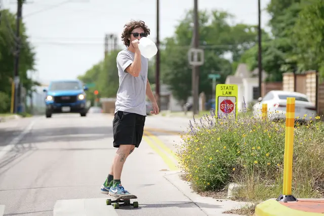 Elijah Nichols rides his skateboard on Chestnut Avenue in East Austin on a hot May 13, when daily temperatures reached 101 degrees.