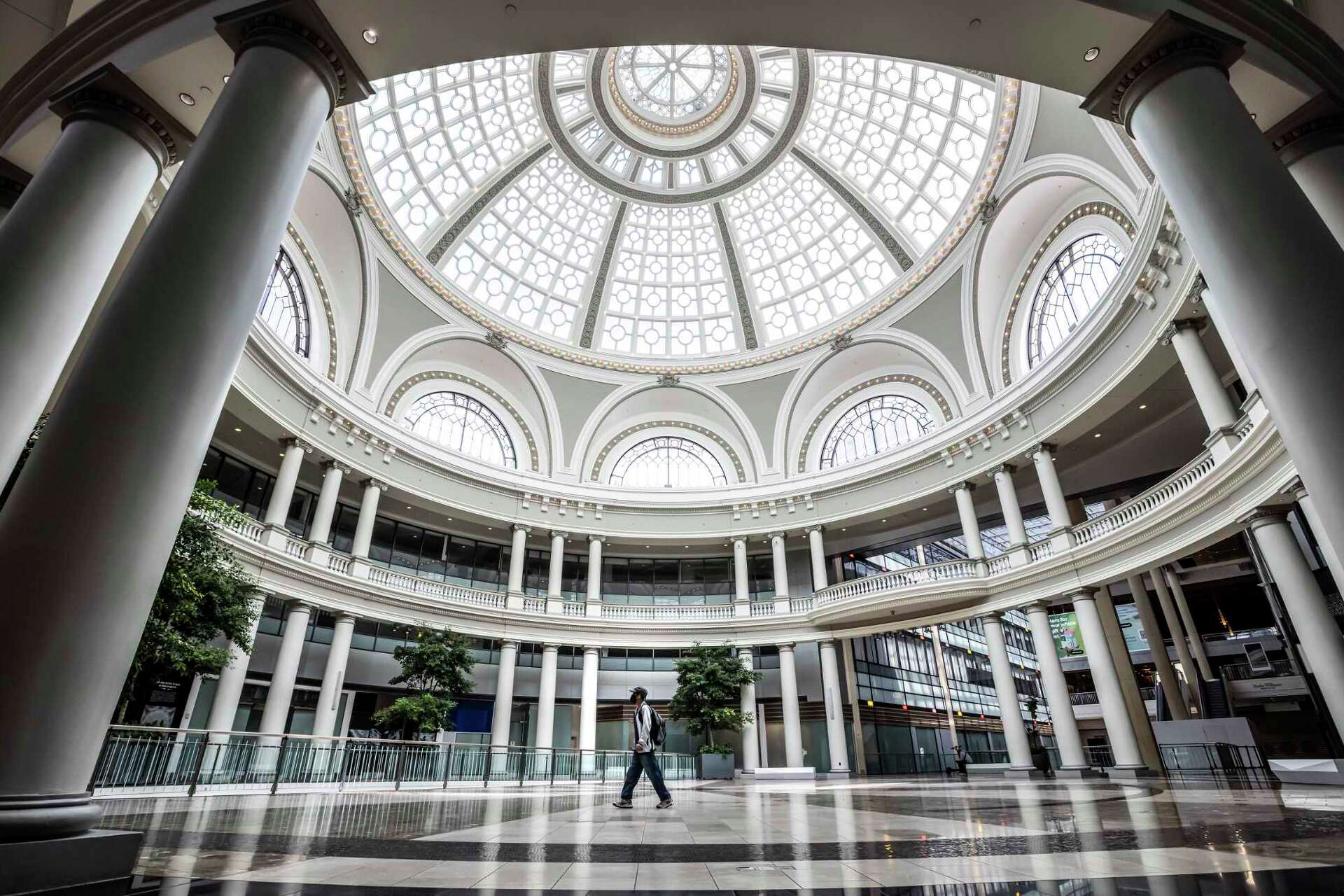 A lone visitor walks under the dome at the San Francisco Centre Mall in San Francisco, in 2025. A development firm has asked the city if the mall, which has bee