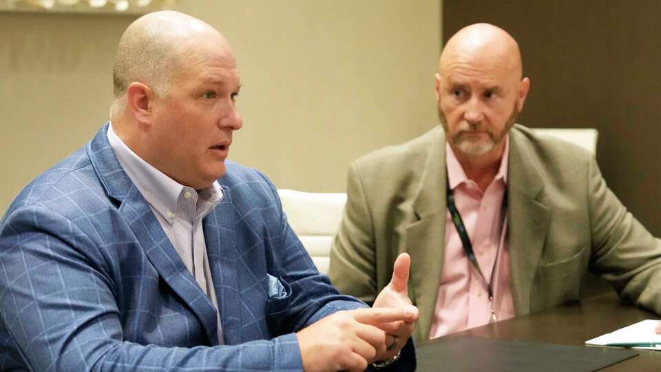 Jon Parrella, TerraFlow Energy CEO, left, and Ian Rock, TerraFlow Energy CTO, right, speak in Houston Thursday, Aug. 14, 2025.