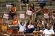 Texas Longhorns fans hold up signs during the game against Utah at Gregory Gymnasium on Friday, Aug. 15, 2025 in Austin, Texas.
