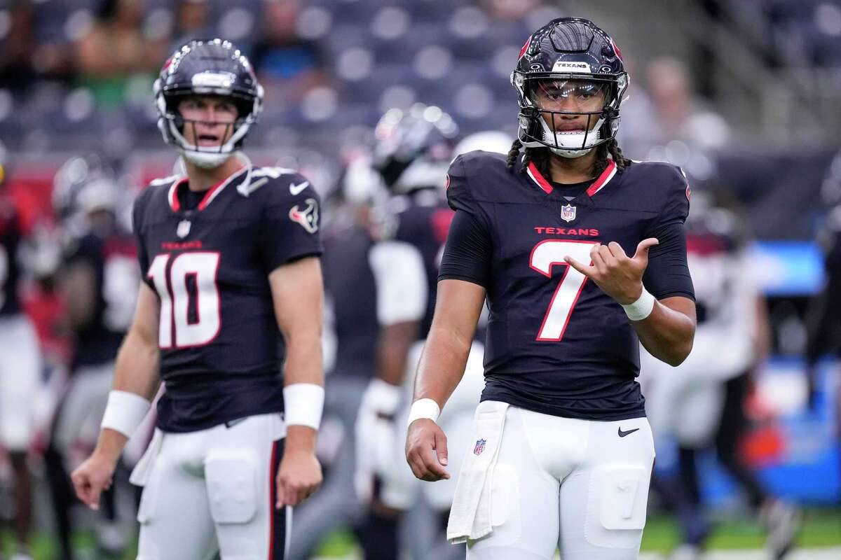 Houston Texans quarterbacks Davis Mills (10) and C.J. Stroud warm up before a preseason NFL football game against the Carolina Panthers at NRG Stadium in Houston, Saturday, Aug. 16, 2025.