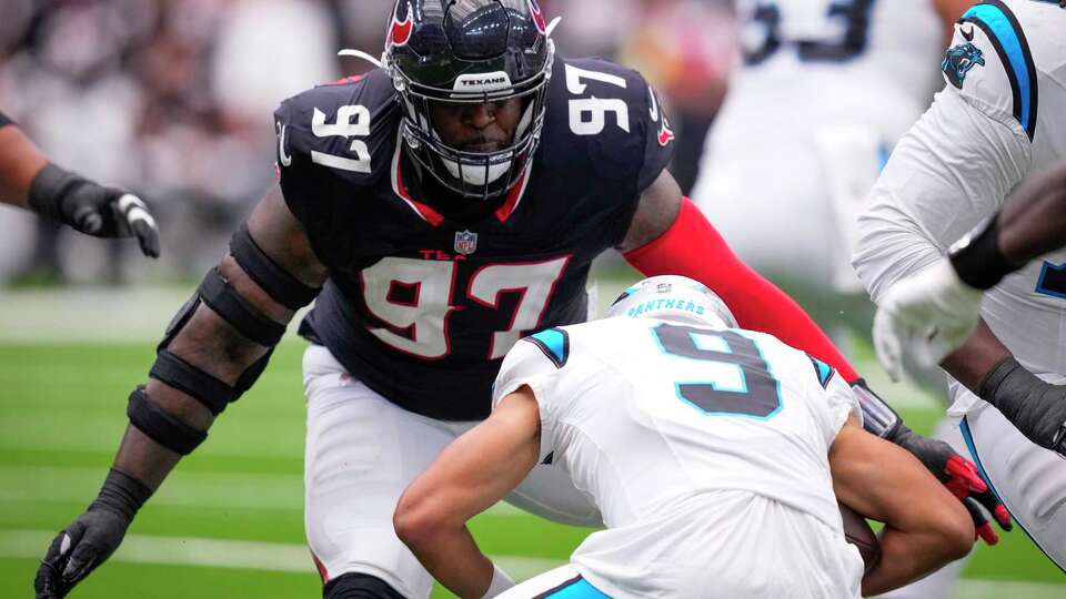 Houston Texans defensive tackle Mario Edwards Jr. (97) sacks Carolina Panthers quarterback Bryce Young (9) during the first half of a preseason NFL football game at NRG Stadium in Houston, Saturday, Aug. 16, 2025.