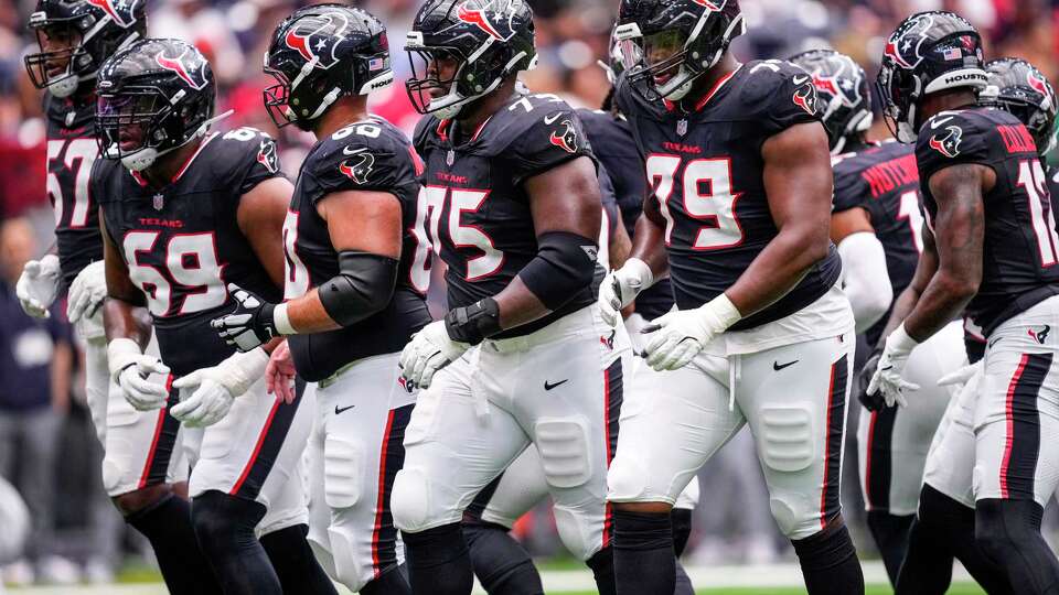 Houston Texans offensive linemen Blake Fisher (57), Ed Ingram (69), Jake Andrews (60), Laken Tomlinson (75), Aireontae Ersery (79) break the huddle during the first half of a preseason NFL football game against the Carolina Panthers at NRG Stadium in Houston, Saturday, Aug. 16, 2025.