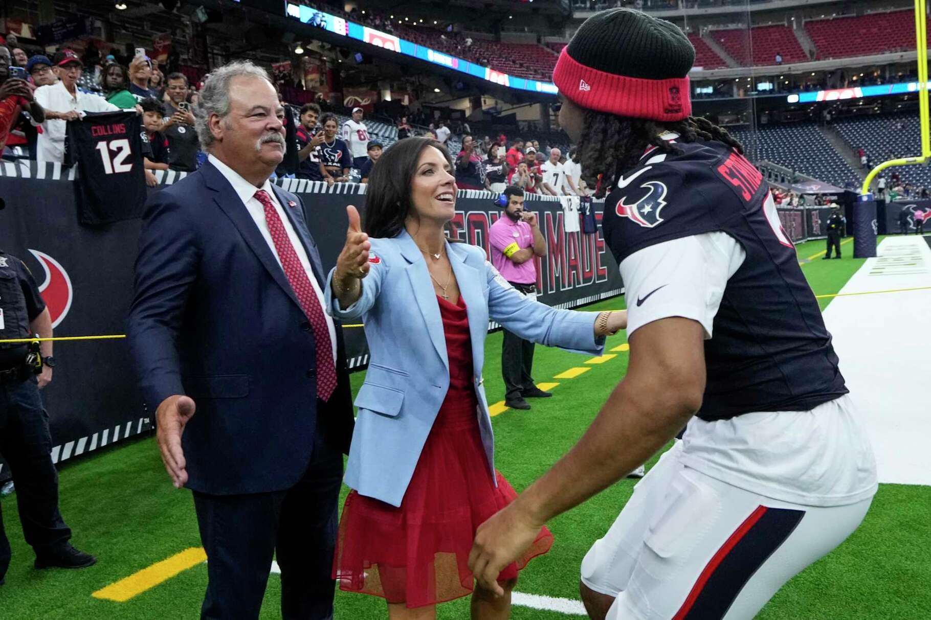 Houston Texans CEO Cal McNair and Hannah McNair reach out to embrace Houston Texans quarterback C.J. Stroud (7) after the Texans 20-3 win over the Carolina Panthers in a preseason NFL football game at NRG Stadium in Houston, Saturday, Aug. 16, 2025.