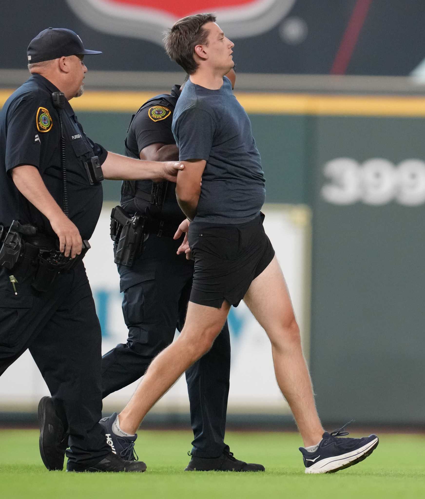 Houston Astros game interrupted by fan on field