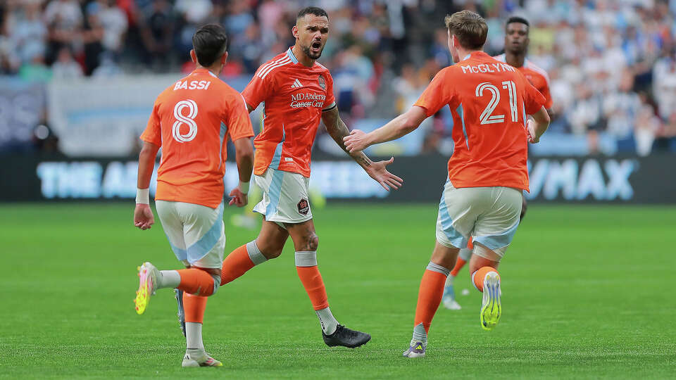 Artur #6 of the Houston Dynamo FC celebrates with teammates after scoring the team's first goal during the MLS match between Vancouver Whitecaps FC and Houston Dynamo FC at BC Place on August 17, 2025 in Vancouver, British Columbia. (Photo by Elizabeth Ruiz Ruiz/Getty Images)