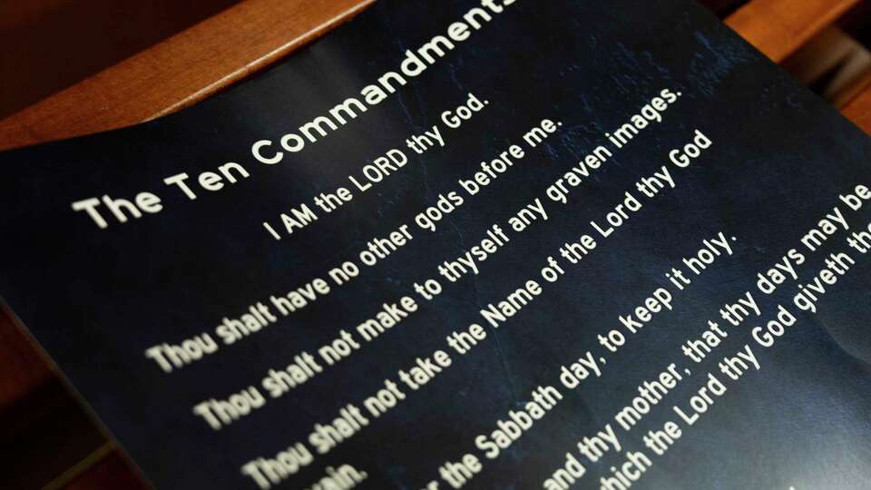 A poster displaying the Ten Commandments is seen after a Conroe ISD school board meeting in Conroe, Tuesday, Aug. 19, 2025. Texas Senate Bill 10 mandates the display of the Ten Commandments in all public school classrooms effective Sept. 1.