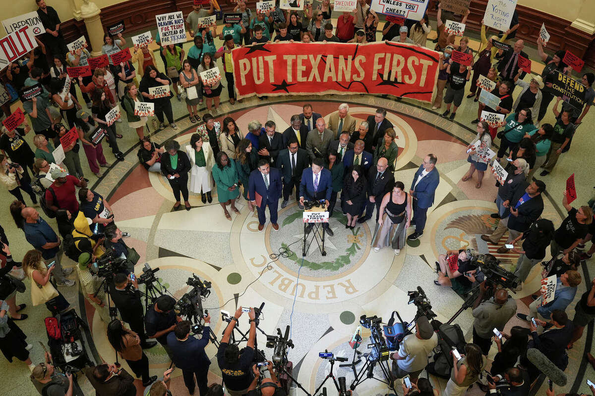 Rep. Gene Wu, D-Houston, and other Democratic state representatives speak at a news conference after the final passage of the congressional redistricting plan at the Capitol in Austin, Wednesday, Aug. 20, 2025.