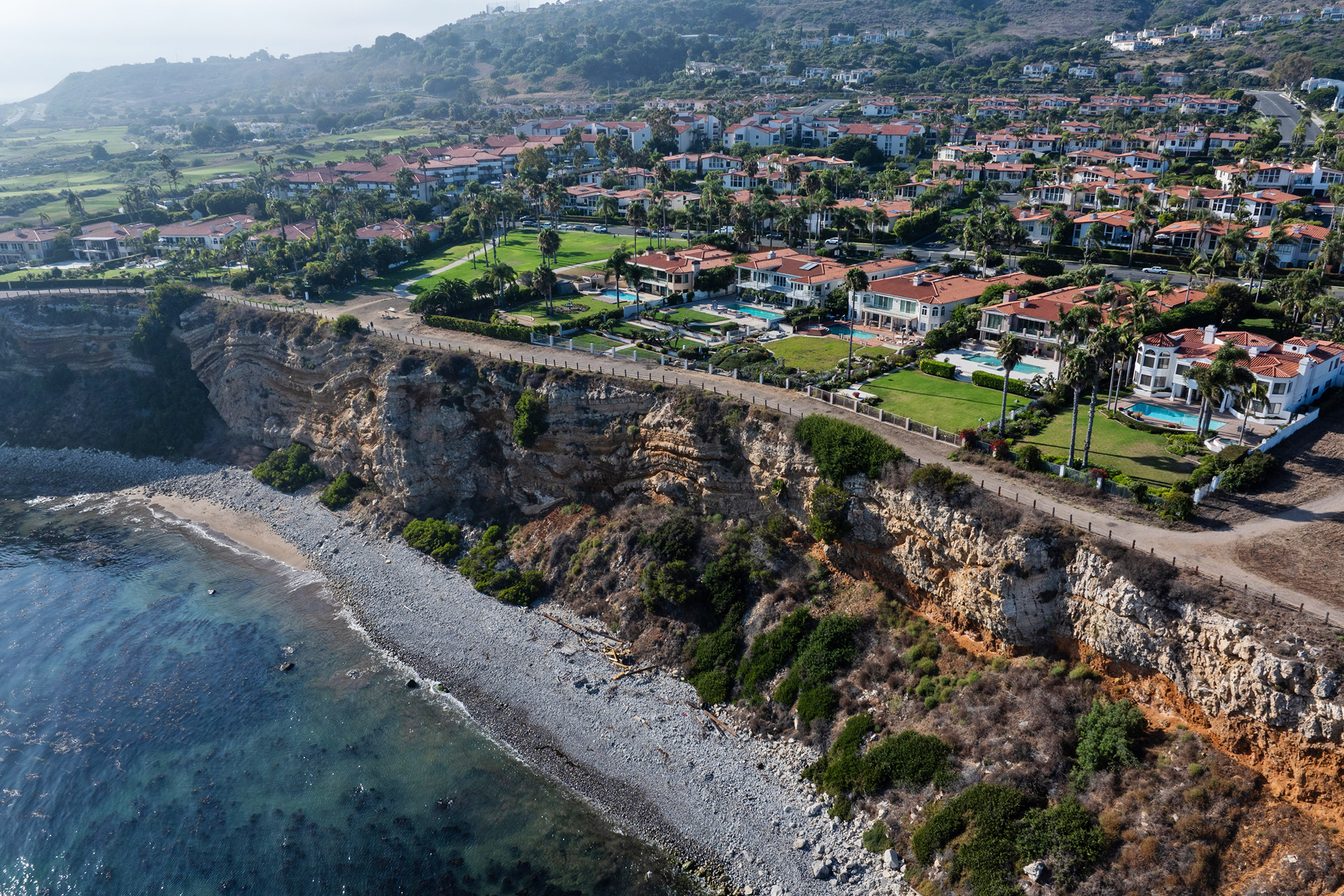 Bluff collapse along California coast damages properties in wealthy neighborhood