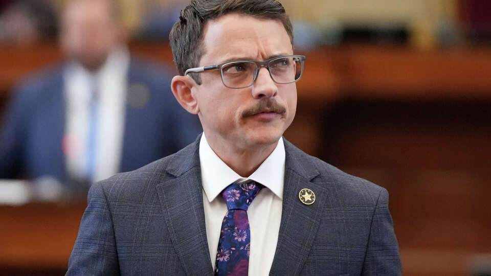 Rep. Briscoe Cain, D- Deer Park, works on the House floor during the debate on a congressional redistricting plan at the Capitol in Austin, Wednesday, Aug. 20, 2025.