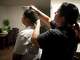 Mily, who is an immigrant from Mexico, brushes the hair of her 10-year-old daughter, Emily, at their home in Manor before driving her to Guerrero Thompson Elementary School in Austin, Thursday, Aug. 28, 2025.