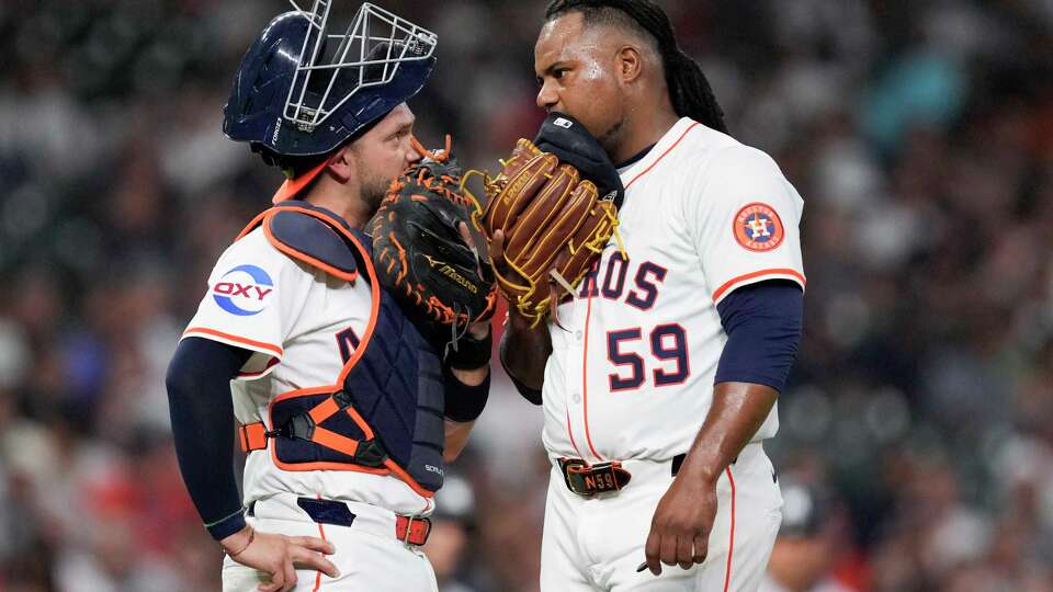 Houston Astros catcher César Salazar and starting pitcher Framber Valdez (59) meet in the mound after Valdez gave up a 2-run home run to New York Yankees second base Jazz Chisholm Jr. during the second inning of a Major League Baseball game at Daikin Park in Houston, Tuesday, Sept. 2, 2025.