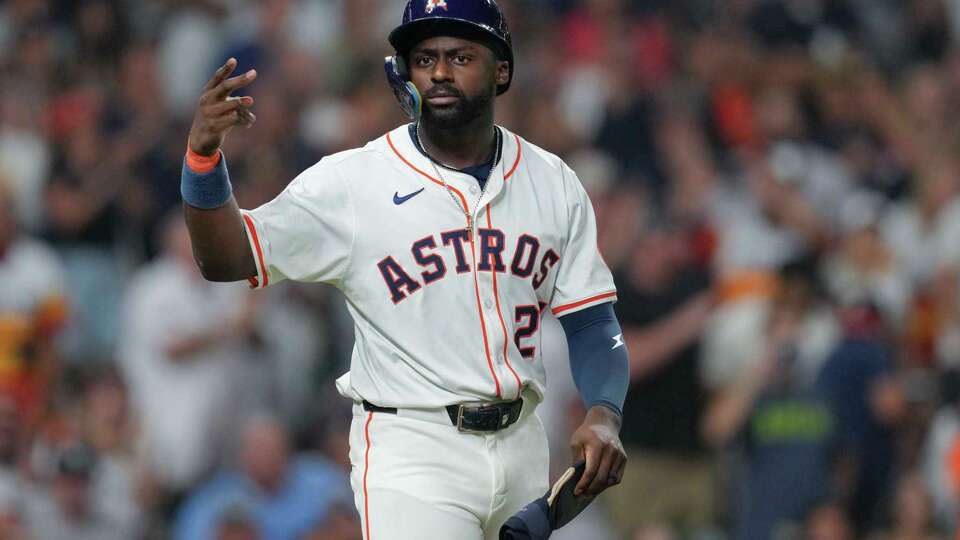 Houston Astros' Taylor Trammell reacts after drawing a bases-loaded walk to break a 4-4 tie during the eighth inning of a MLB baseball game in Houston, Wednesday, Sept. 3, 2025.