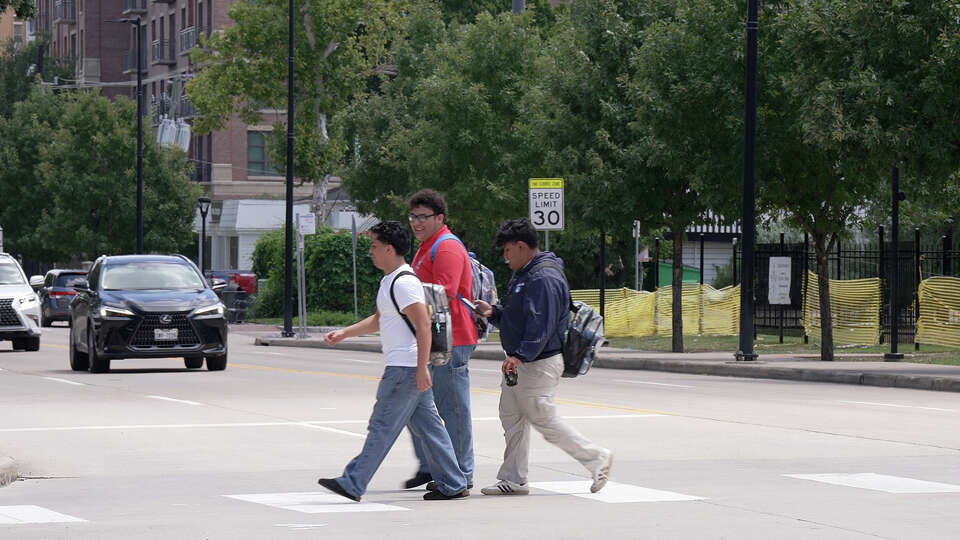 Lamar High School students cross Westheimer Road on Thursday August 28, 2025. A Lamar High School student was hit and injured by an SUV while crossing Westheimer Road on August 20, 2025