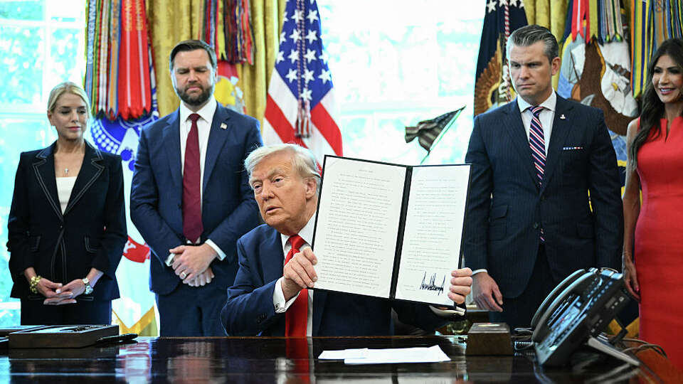 US President Donald Trump holds up an executive order he signed that aims to end cashless bail, in the Oval Office of the White House in Washington, DC on August 25, 2025. Also pictured, L/R, US Attorney General Pam Bondi, Vice President JD Vance, Defense Secretary Pete Hegseth and US Secretary of Homeland Security Kristi Noem (Photo by Mandel NGAN / AFP) (Photo by MANDEL NGAN/AFP via Getty Images)