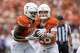 Texas Longhorns quarterback Arch Manning (16) fakes a hand off to Texas Longhorns running back CJ Baxter (4) during the game against San Jose State at Darrell K Royal–Texas Memorial Stadium in Austin, Saturday, Sept. 6, 2025.
