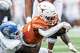 Texas Longhorns running back CJ Baxter (4) advances the ball during the game against San Jose State at Darrell K Royal–Texas Memorial Stadium in Austin, Saturday, Sept. 6, 2025.