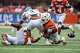 Texas Longhorns linebackers Anthony Hill Jr. (0) and Ty'Anthony Smith (26) force a fumble by San José State running back Floyd Chalk IV (3) during the game at Darrell K Royal–Texas Memorial Stadium on Saturday, Sept. 6, 2025.