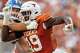 Texas Longhorns linebacker Zina Umeozulu (19) runs to take down San Jose State Spartans quarterback Walker Eget (5) during the game against San Jose State at Darrell K Royal–Texas Memorial Stadium in Austin, Saturday, Sept. 6, 2025.