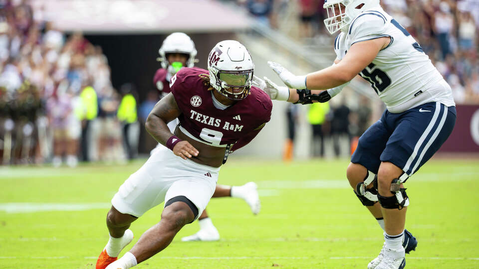Texas A&M defensive lineman Cashius Howell (9) runs past Utah State offensive lineman Jake Eichorn in the first half Sept. 6, 2025 against Utah State at Kyle Field in College Station.