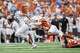 Texas Longhorns defensive back Warren Roberson (24) dives to tackle San Jose State Spartans wide receiver Danny Scudero (10) during the game against San Jose State at Darrell K Royal–Texas Memorial Stadium in Austin, Saturday, Sept. 6, 2025.