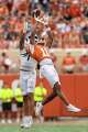 Texas Longhorns defensive back Kade Phillips (11) jumps in an interception attempt from San Jose State Spartans wide receiver Leland Smith (1) during the game against San Jose State at Darrell K Royal–Texas Memorial Stadium in Austin, Saturday, Sept. 6, 2025.