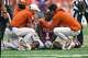 Trainers check on injured Texas Longhorns edge rusher Colin Simmons (1) during the game against San José State at Darrell K Royal–Texas Memorial Stadium on Saturday, Sept. 6, 2025.