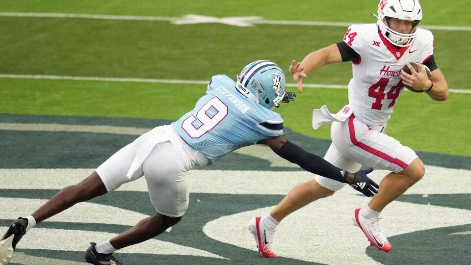 Houston running back Dean Connors (44) runs past Rice safety Peyton Stevenson (9) during the first half of of an NCAA college football game in Houston, Saturday, Sept. 6, 2025.