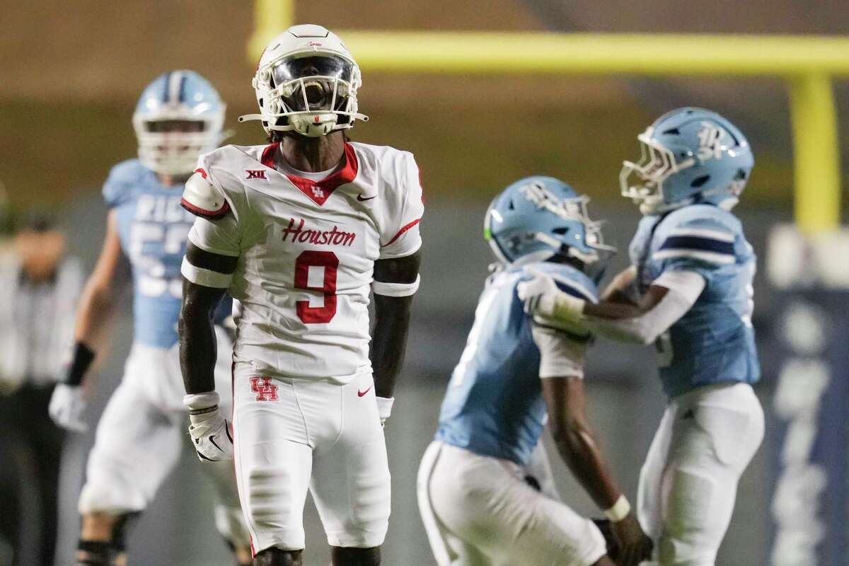 Houston defensive back Blake Thompson (0) reacts after sacking Rice quarterback Chase Jenkins during the second half of of an NCAA college football game in Houston, Saturday, Sept. 6, 2025.