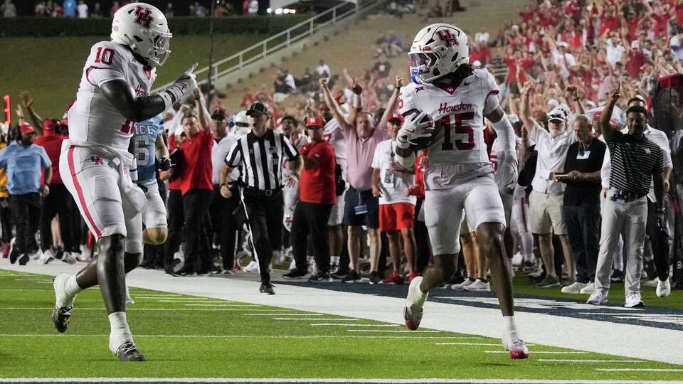 Houston defensive back Will James (15) returns an interception for a 37-yard touchdown during the second half of of an NCAA college football game in Houston, Saturday, Sept. 6, 2025.