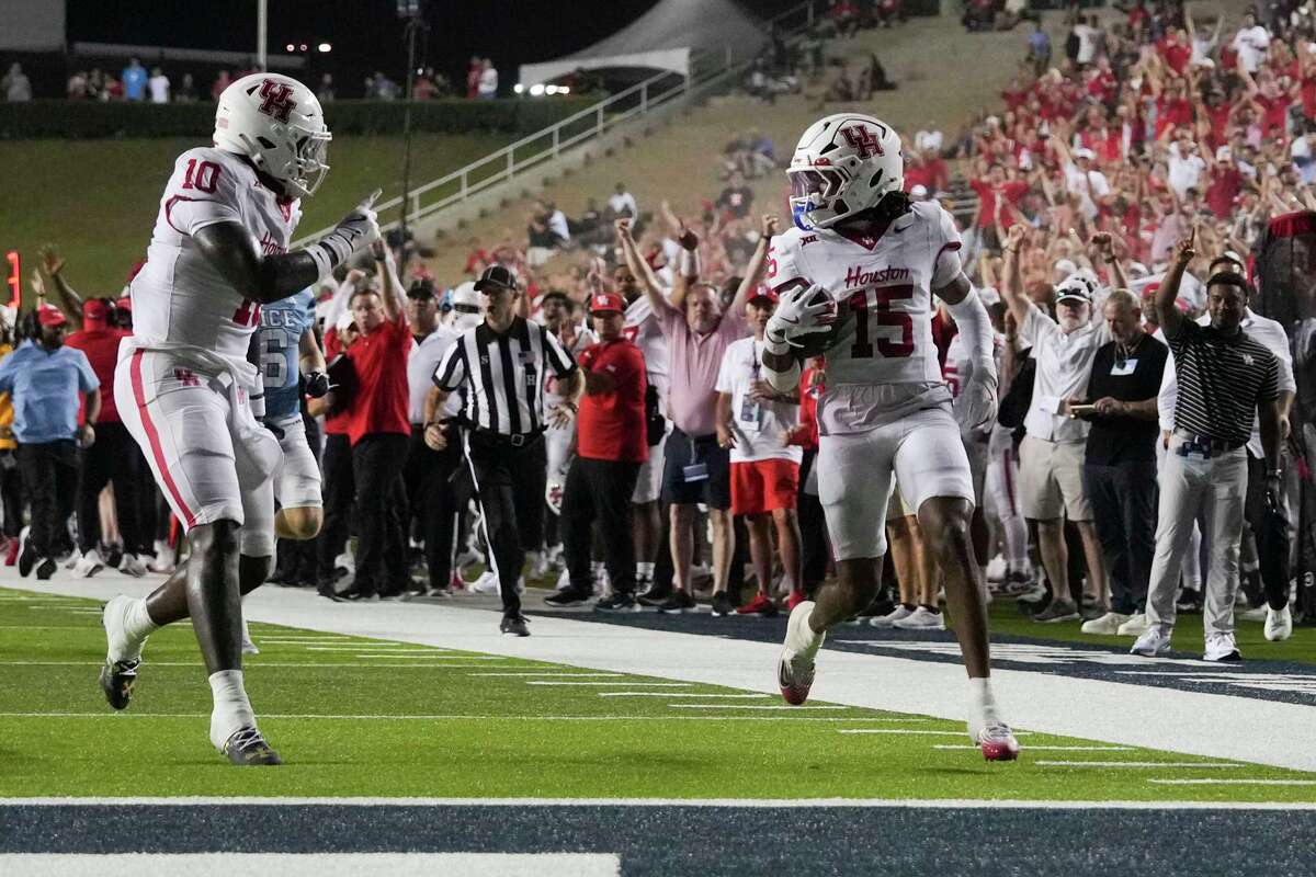 Houston defensive back Will James (15) returns an interception for a 37-yard touchdown during the second half of of an NCAA college football game in Houston, Saturday, Sept. 6, 2025.