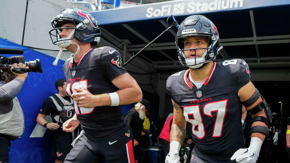 Houston Texans tight end Cade Stover (87) runs out onto the field before an NFL football game at SoFi Stadium in Inglewood, Calif., Sunday, Sept. 7, 2025.