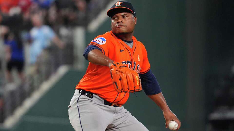 Houston Astros starting pitcher Framber Valdez winds up to throw during a baseball game against the Texas Rangers, Sunday, Sept. 7, 2025, in Arlington, Texas. (AP Photo/LM Otero)