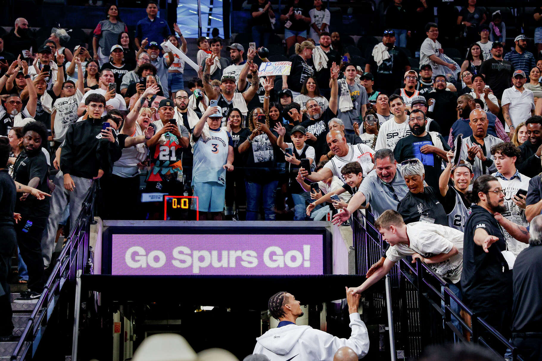 In April, after the final game of the San Antonio Spurs' 2024-2025 season, Victor Wembanyama says goodbye to the fans while walking back to the locker room at Frost Bank Center.