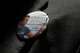 A man wore a button with an image of Charlie Kirk as members of Turning Point USA held a vigil for Kirk on Sept. 11 at the campus of Texas A&M University in College Station.