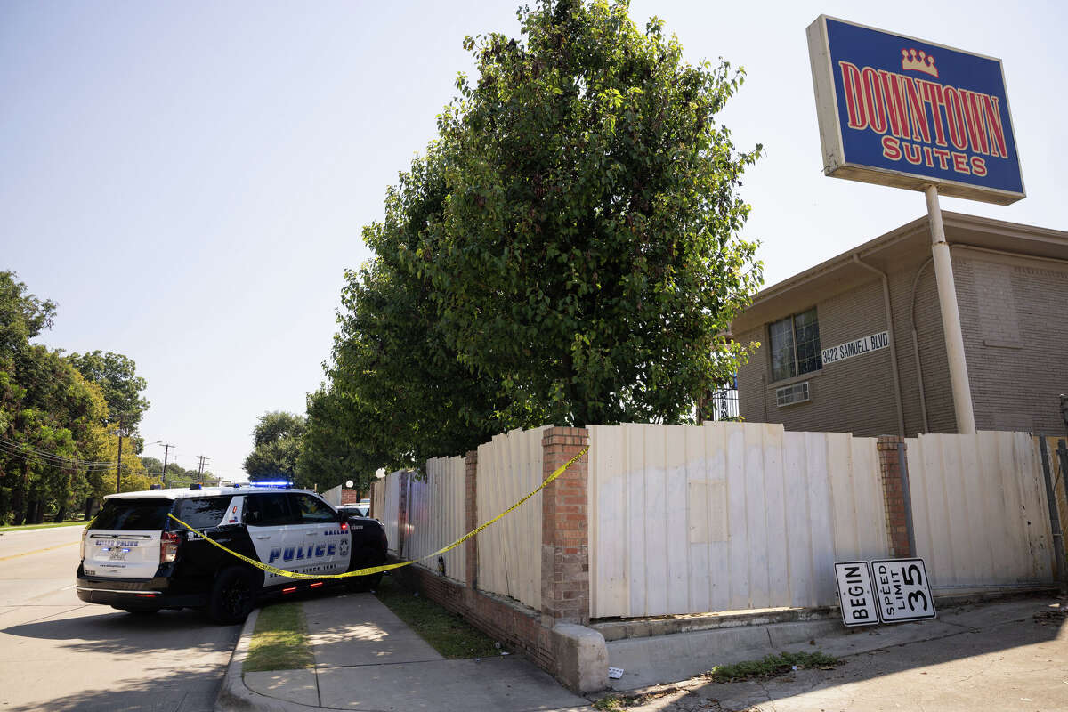 Dallas police work the scene as they respond to a report of a stabbing at the Downtown Suites motel in the 3400 block of Samuell Boulevard in Dallas on Wednesday, Sept. 10, 2025.