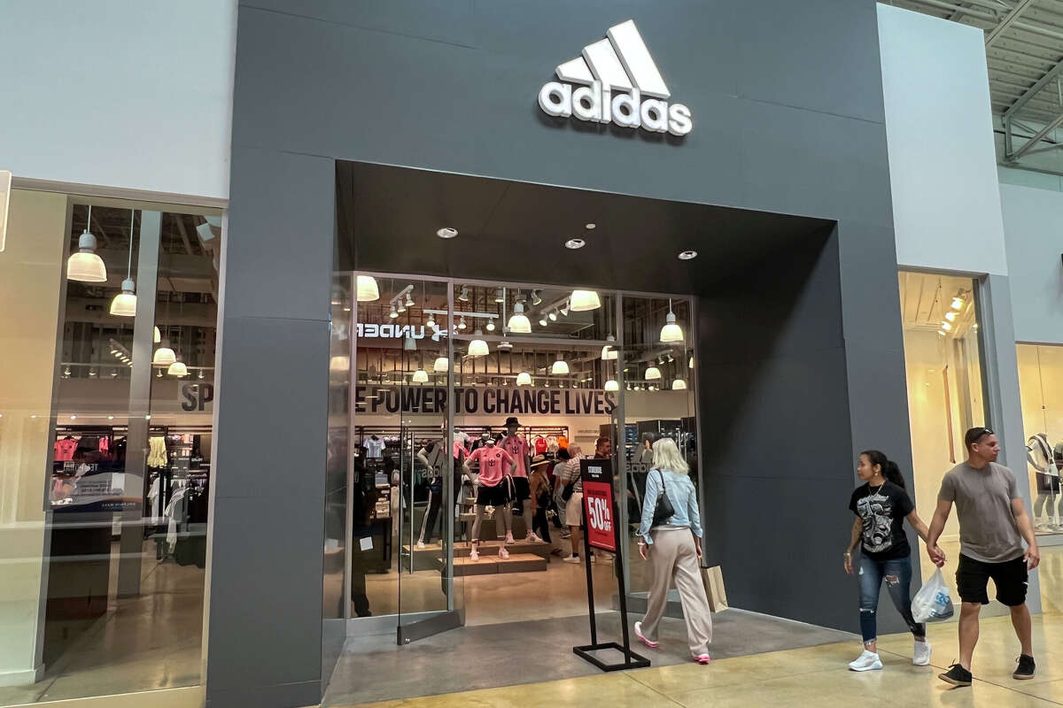 Customers walk into an Adidas store on April 04, 2025 in Miami, Florida. 