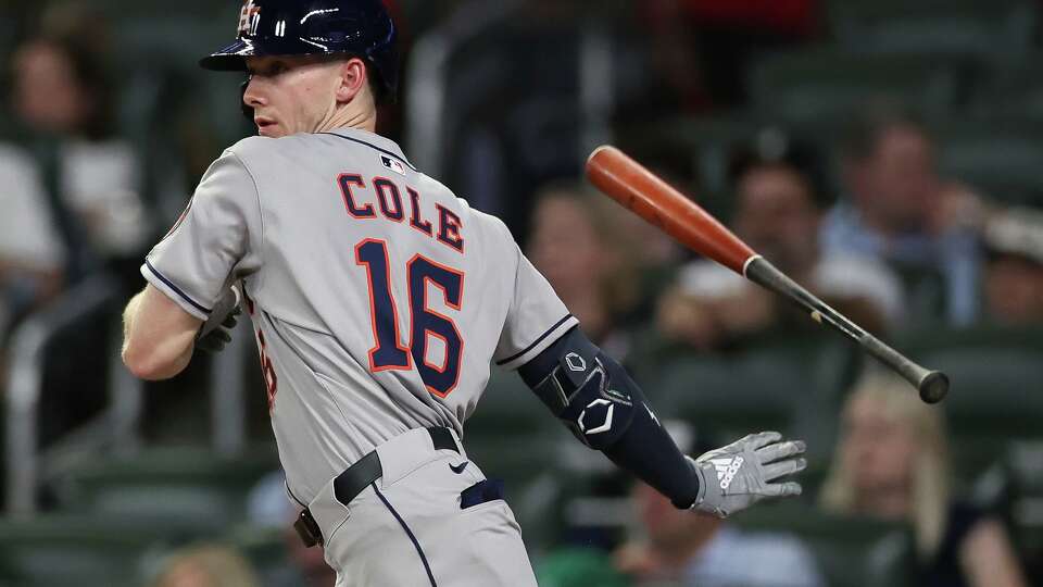 Houston Astros' Zach Cole flips away his bat after hitting an RBI single in the fourth inning of a baseball game against the Atlanta Braves, Friday, Sept. 12, 2025, in Atlanta. (AP Photo/Colin Hubbard)