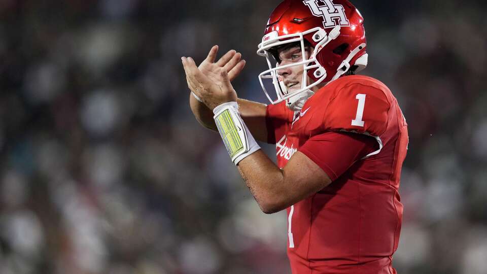 Houston quarterback Conner Weigman (1) reacts after running for a 1-yard touchdown during the second half of a Big 12 Conference college football game in Houston, Friday, Sept. 12, 2025.