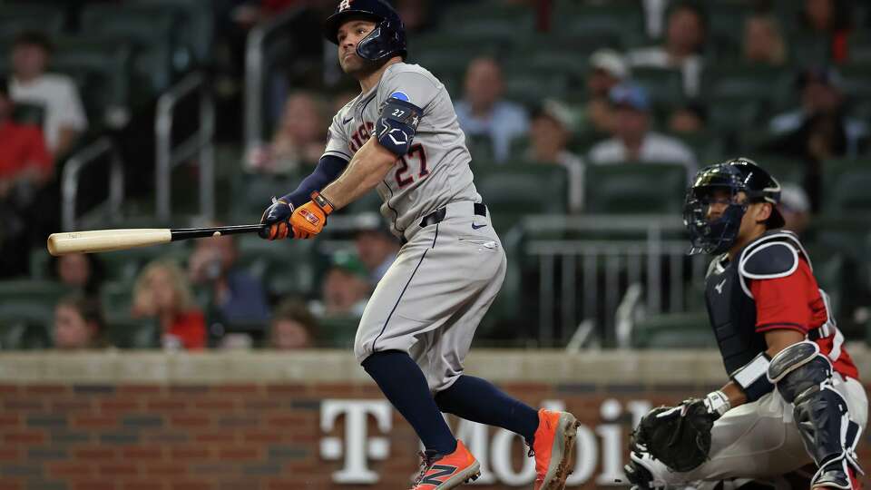 Houston Astros' Jose Altuve (27) hits a solo home run in the sixth inning of a baseball game against the Atlanta Braves, Friday, Sept. 12, 2025, in Atlanta. (AP Photo/Colin Hubbard)