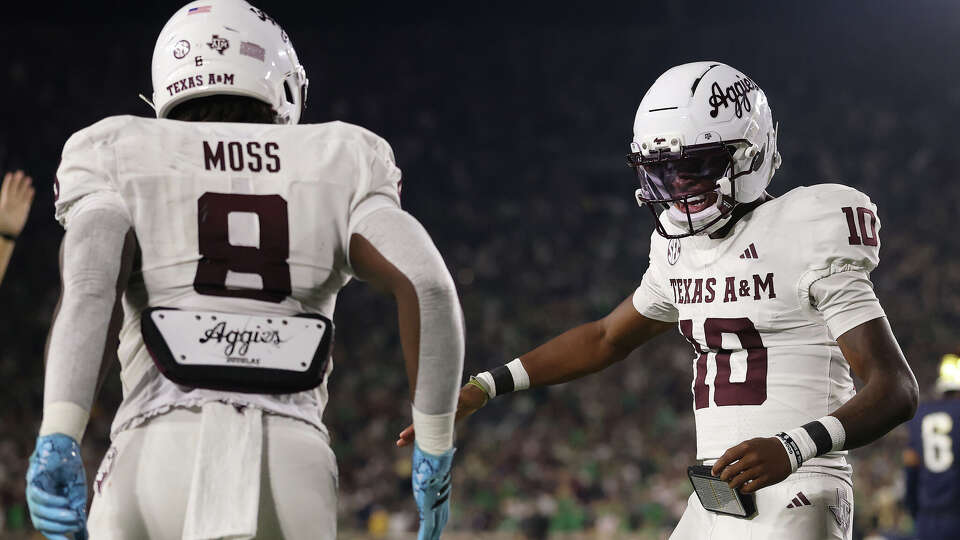Texas A&M running back Le'Veon Moss (8) of  celebrates a touchdown run with Marcel Reed against Notre Dame during the first half at Notre Dame Stadium on Sept. 13, 2025 in South Bend, Indiana.