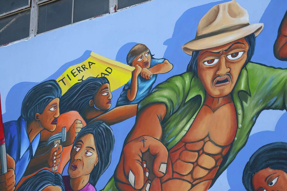 Characters fill the restored mural 'The Rebirth of Our Nationality', Thursday, June 7, 2018, in Houston. The mural at 5900 Canal Street was originally painted by Leo Tanguma in the early 1970s. Harris County, the building's current owner, commissioned Gonzo to recreate the badly faded and peeling mural last year, with Tanguma as a consultant. ( Mark Mulligan / Houston Chronicle )