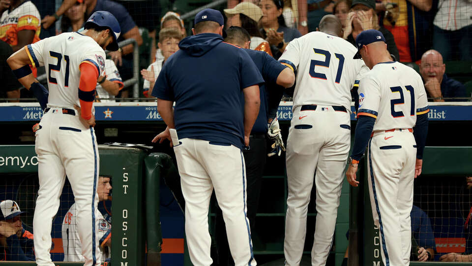 Yordan Alvarez #44 of the Houston Astros is helped off the field turning his ankle at home plate in the first inning against the Texas Rangers at Daikin Park on September 15, 2025 in Houston, Texas. (Photo by Kenneth Richmond/Getty Images)