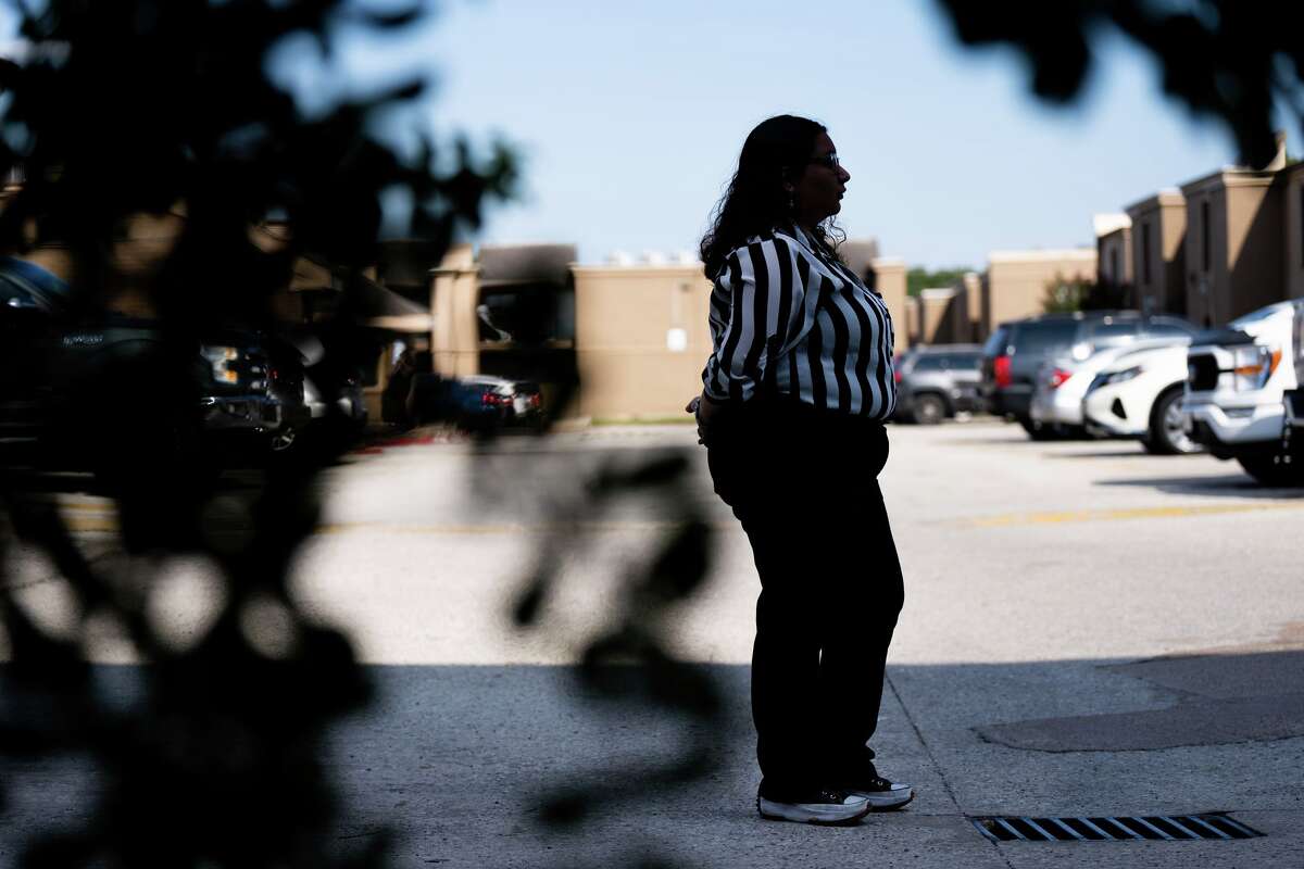 Alejandra poses outside her apartment complex in Houston, TX on September 16, 2025. At 5:50 a.m. late last month, Alejandra counted 18 vehicles lined up inside her apartment complex in the southwest Houston area where she has lived all her 18 years. Her family was fearful it was an ICE raid.