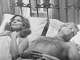 Barbra Streisand as Katie, left, lies in bed next to Robert Redford as Hubbell in “The Way We Were.”