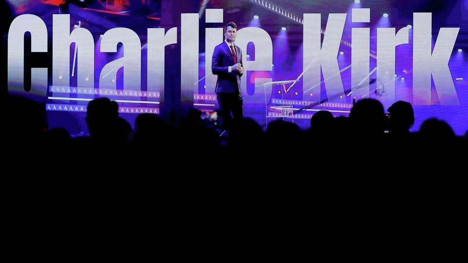 A video montage in tribute to Charlie Kirk plays on screens during the first day of the Texas Youth Summit, held at the Waterway Marriott Friday, Sep. 19, 2025 in The Woodlands, Texas.
