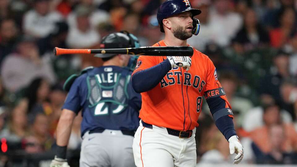 Houston Astros Christian Walker (8) tosses his bat in the air after striking out to end the seventh inning of a MLB baseball game in Houston, Friday, Sept. 19, 2025.
