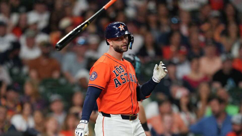 Houston Astros Christian Walker (8) tosses his bat in the air after striking out to end the seventh inning of a MLB baseball game in Houston, Friday, Sept. 19, 2025.
