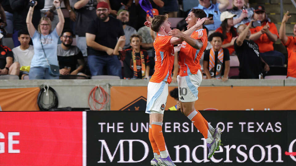 Ezequiel Ponce (right) celebrates his goal with Dynamo teammate Jack McGlynn. It held up as the only score in Houston's win over Portland on Saturday night.